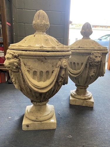 Lot 834 - A pair of composite stone neoclassical style...