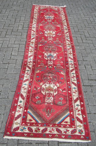 Lot 852 - A Hamadan runner with red ground 340 x 91cm