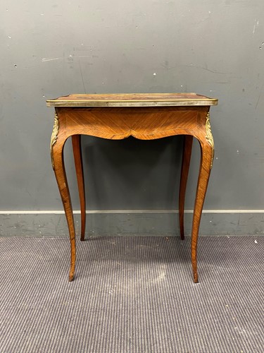 Lot 673 - A French Louis XV style marquetry occasional...