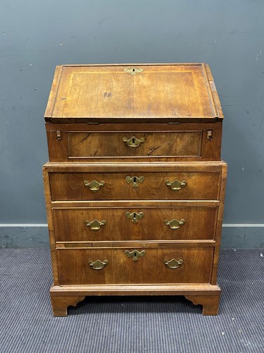 Lot 676 - An 18th century and later walnut bureau with...