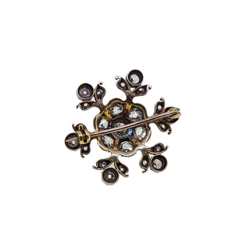 Lot 8 - A Victorian diamond set snowflake style brooch