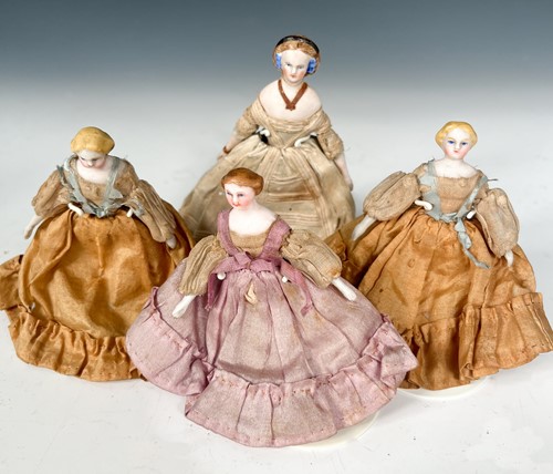 Lot 34 - A group of four bisque shoulder head dolls' house dolls, 19th century