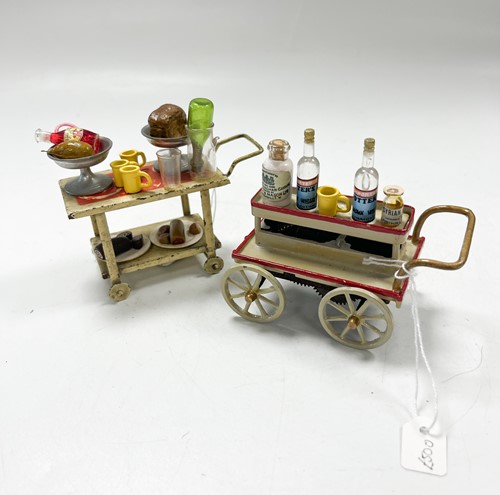 Lot 20 - A miniature painted metal mechanical drinks trolley, 20th century