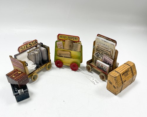 Lot 19 - Two dolls' newspaper cart trollies