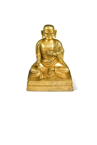 Lot 84 - A Chinese or Tibetan gilt bronze figure of a Luohan