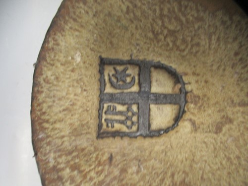 Lot 65 - A stoneware Studio pottery dish with heraldic...