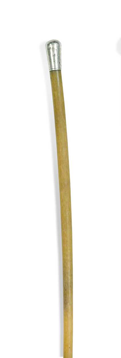Lot 45 - A silver mounted rhino horn riding crop,