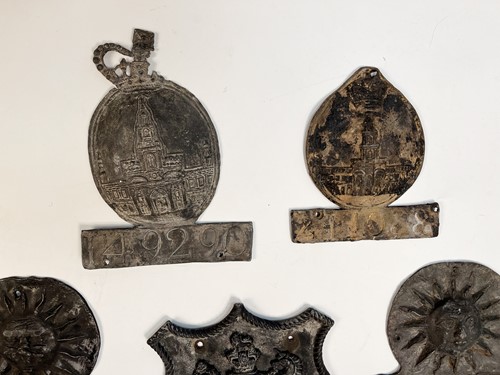 Lot 622 - A collection of seven lead fire insurance plaques or marks