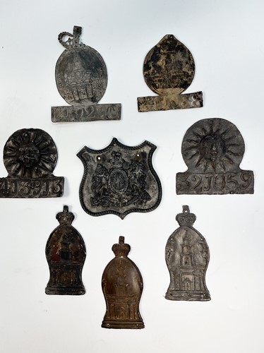 Lot 622 - A collection of seven lead fire insurance plaques or marks
