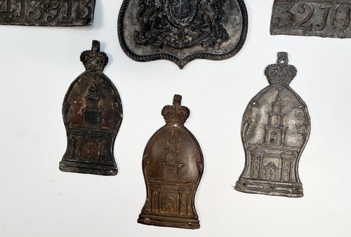 Lot 622 - A collection of seven lead fire insurance plaques or marks