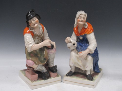 Lot 43 - A group of Staffordshire pottery figures, pair...