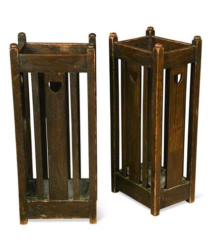 Lot 242 - Liberty & Co., a pair of Arts & Crafts oak stick stands