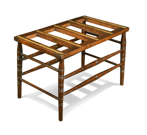 Lot 230 - An Aesthetic period stained beech luggage rack