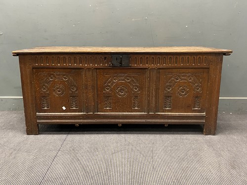 Lot 679 - Large carved oak coffer, 64cm x 155cm x 57cm