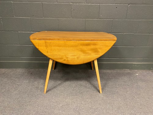 Lot 764 - An Ercol drop-leaf dining table on square...