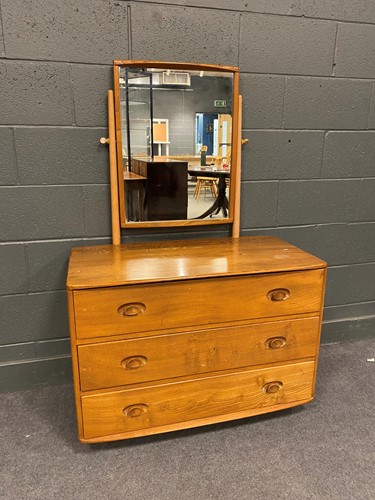Lot 760 - A 20th century Ercol type dressing table with...