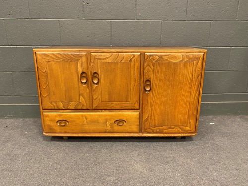 Lot 762 - A 20th century Ercol type stained elm...
