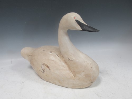 Lot 11 - A 20th century carved wood and painted decoy...