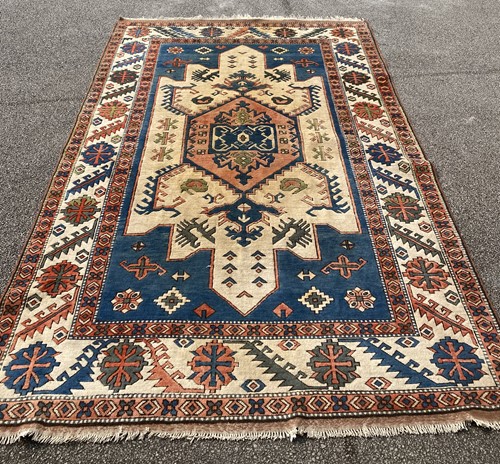 Lot 860 - A modern tribal rug with central medallion and...