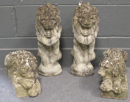 Lot 833 - Two pairs of composite stone garden lions, one...