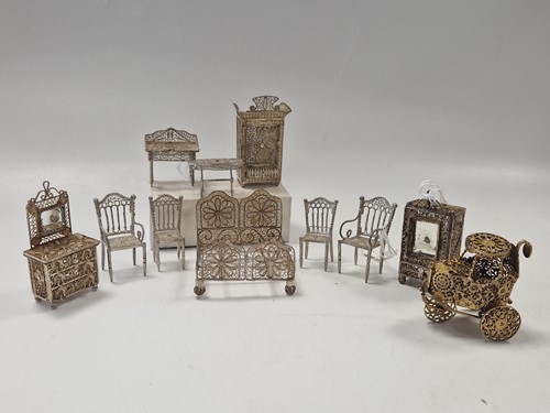 Lot 7 - A suite of dolls' house white metal filigree furniture