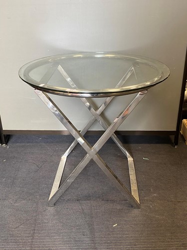 Lot 449 - A modern circular glass topped table on a...