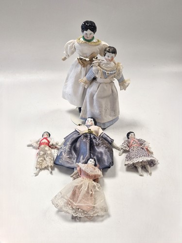 Lot 36 - A group of three German china shoulder head dolls' house dolls, late 19th century