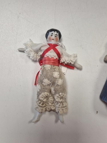 Lot 36 - A group of three German china shoulder head dolls' house dolls, late 19th century