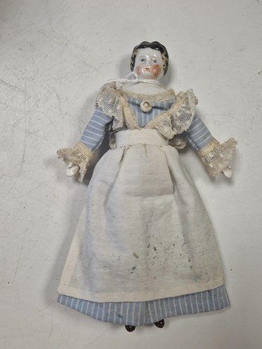 Lot 36 - A group of three German china shoulder head dolls' house dolls, late 19th century