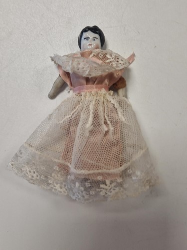 Lot 36 - A group of three German china shoulder head dolls' house dolls, late 19th century
