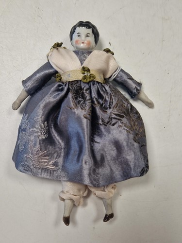 Lot 36 - A group of three German china shoulder head dolls' house dolls, late 19th century
