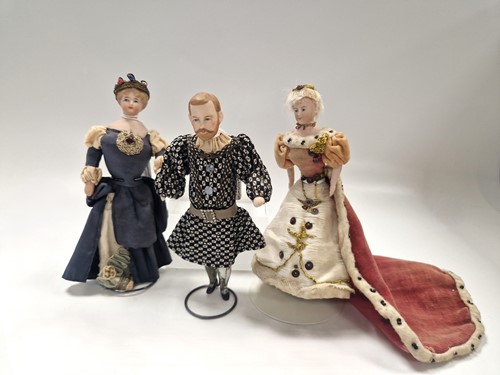 Lot 84 - A matched group of three bisque shoulder head theatrical dolls, early 20th century 