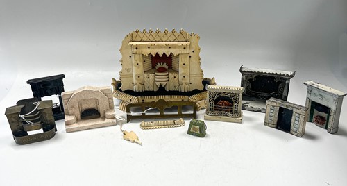 Lot 9 - A collection of eight dolls' house fireplaces, 20th century