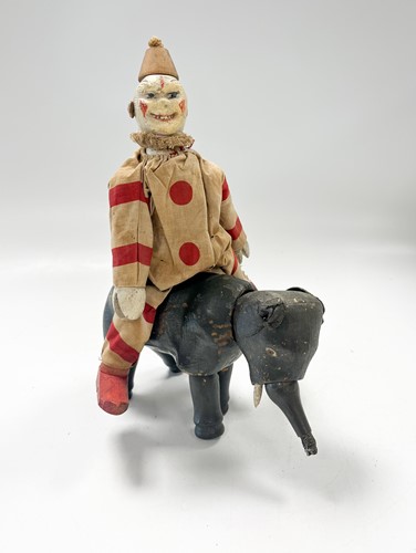 Lot 116 - A Schoenhut jointed wooden elephant and clown, early 20th century