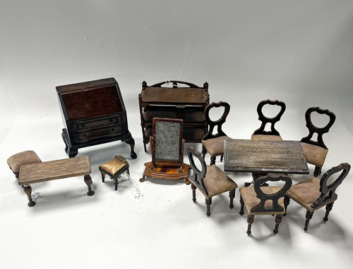 Lot 6 - A collection of simulated rosewood dolls' house furniture, probably Waltershausen