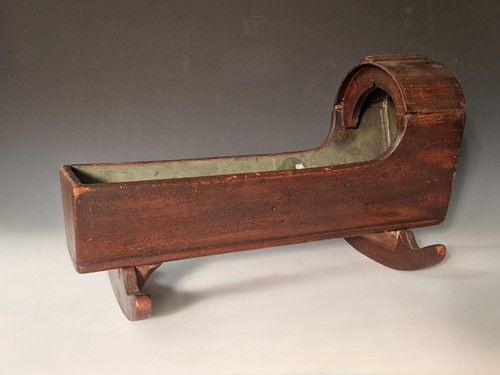 Lot 29 - A carved oak dolls' cradle, 19th century