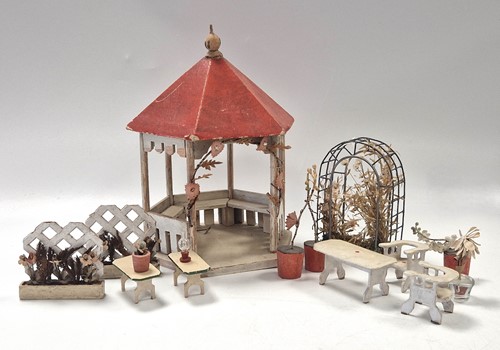 Lot 10 - A collection of dolls' house garden furniture items, 20th century