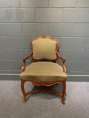 Lot 808 - A French Regence stained beech open armchair,...