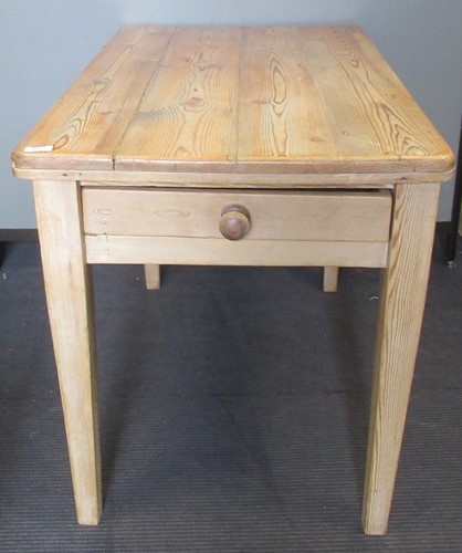 Lot 803 - A 20th century pine kitchen table, the plank...