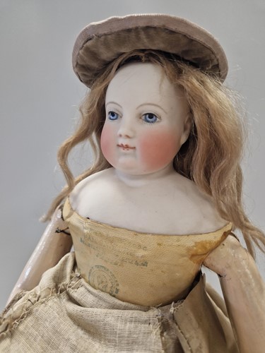 Lot 50 - An Adelaide Huret bisque shoulder head fashion doll with accessories