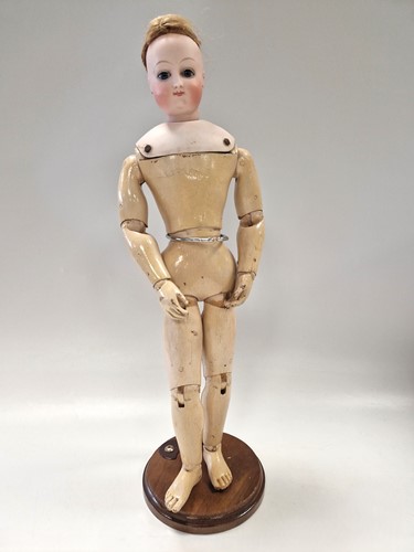 Lot 55 - An unmarked shoulder head bisque fashion doll, possibly by Barrois