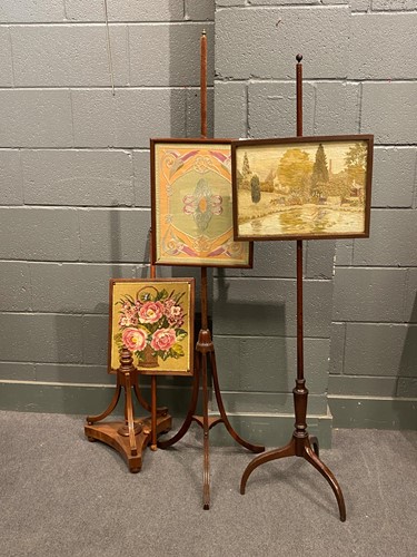 Lot 606 - Three mahogany polescreens together with pair...