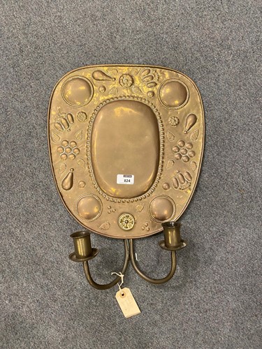 Lot 824 - An Arts and Crafts repousse brass two-branch...