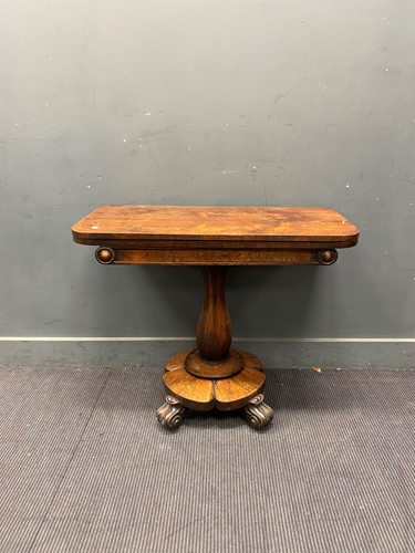 Lot 660 - An early Victorian mahogany tea table faceted...