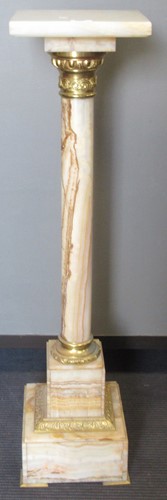 Lot 704 - A late Victorian century onyx and gilt metal...