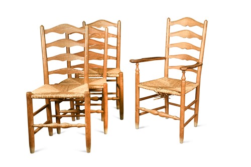 Lot 263 - After Ernest Gimson, a composed set of eight ash 'Russell' ladder back dining chairs