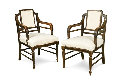 Lot 226 - A pair of Aesthetic period mahogany elbow chairs