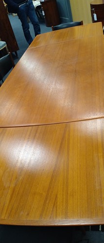 Lot 345 - A mid-century Danish teak extending dining table and six chairs, circa 1960