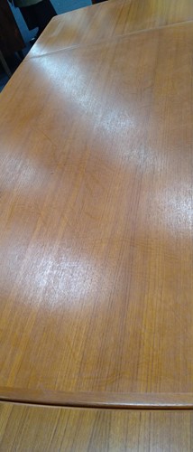 Lot 345 - A mid-century Danish teak extending dining table and six chairs, circa 1960