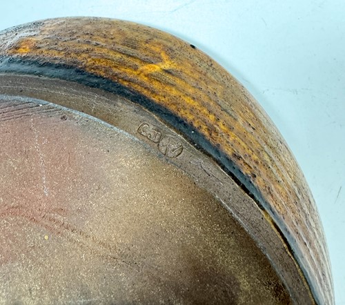 Lot 56 - Charles Tustin (1922-1966) at WInchcombe Pottery, a slipware dish